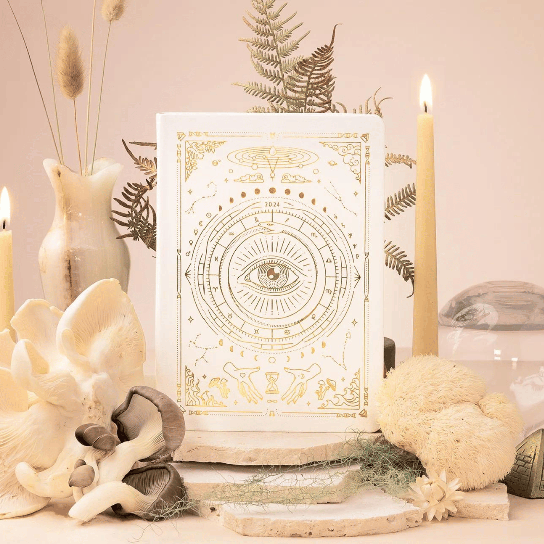 https://www.wildrootsapothecary.com/cdn/shop/files/2024AstrologyPlannerWhite_1600x.png?v=1700940102